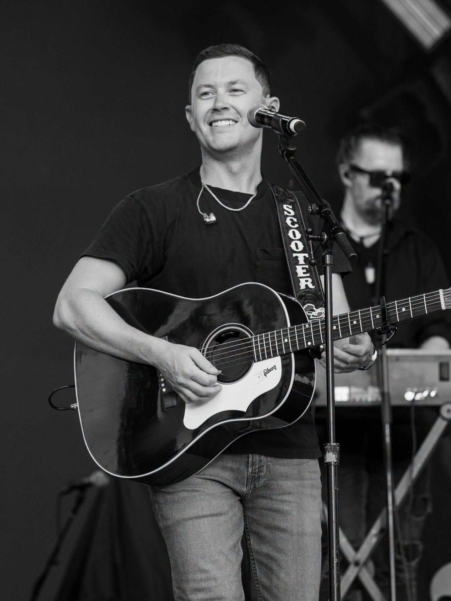 Scotty McCreery performing live with his Gibson acoustic guitar.