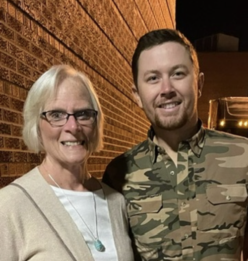 Scotty McCreery with August 2026 Fan of the Month Charlene D