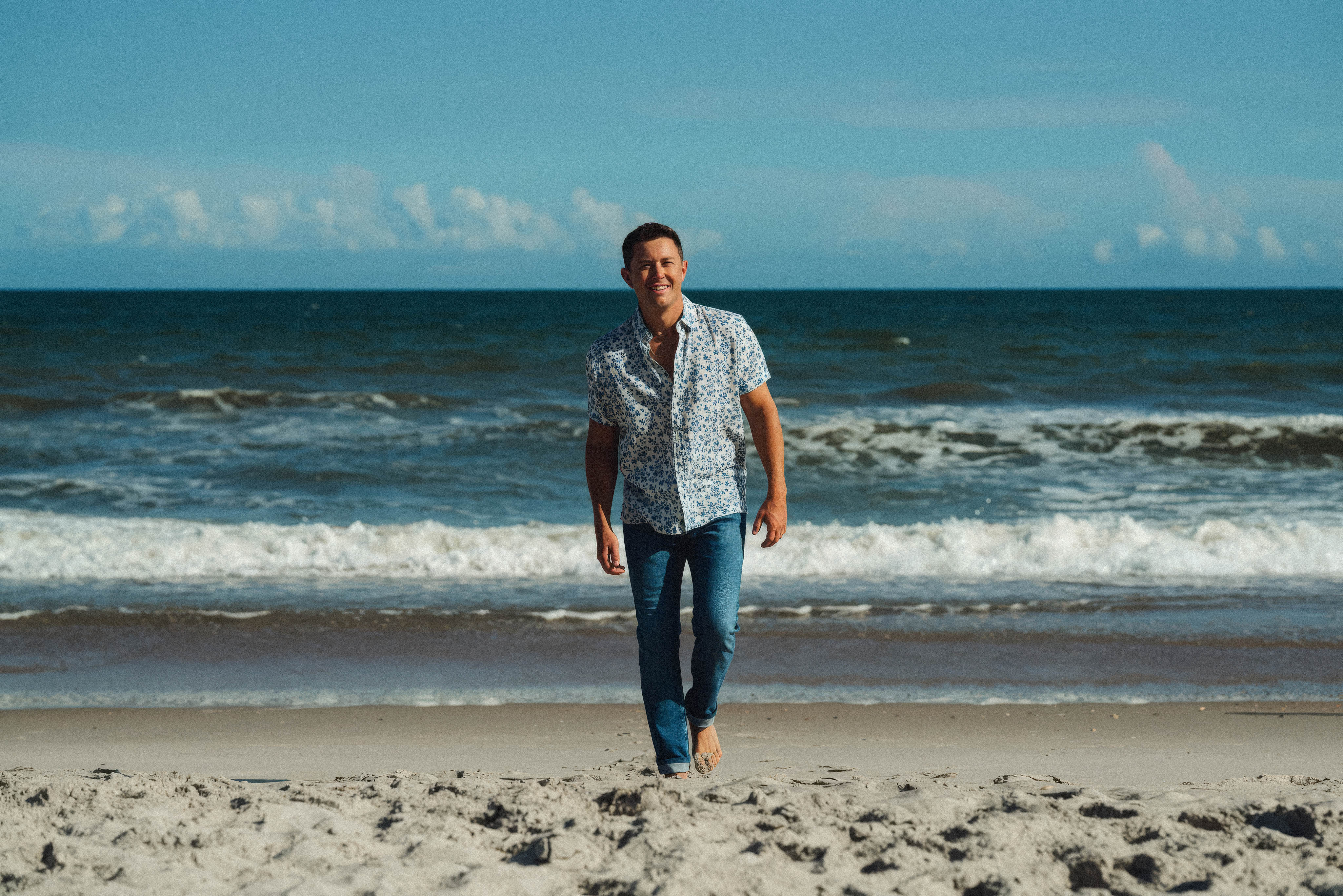 Scotty McCreery walking on the beach in North Carolina.